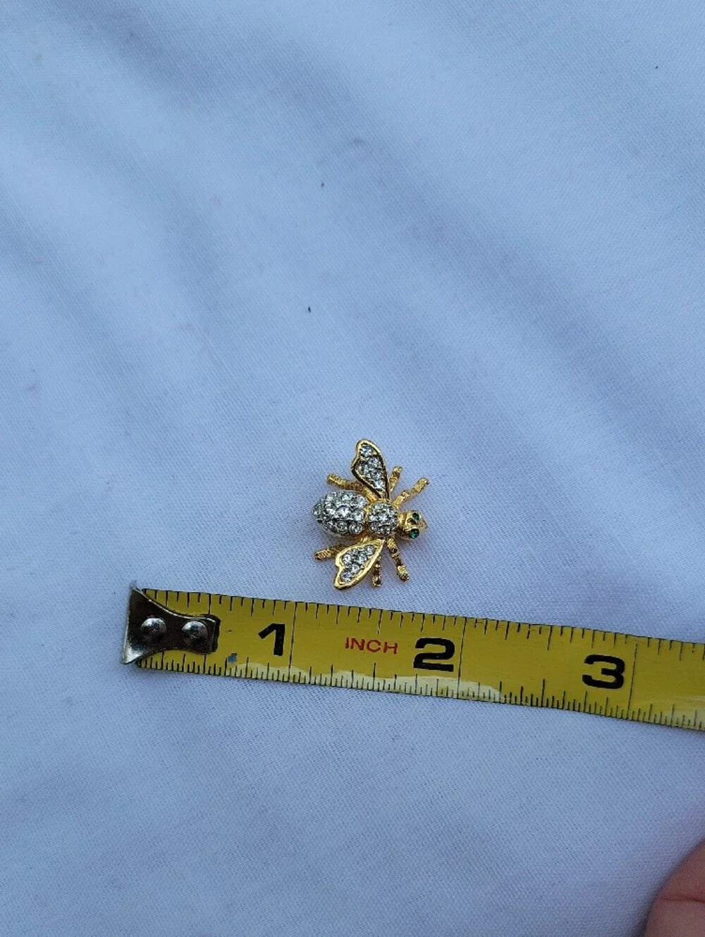 Vintage Joan Rivers Gold Tone Bee Brooch with Clear Crystals and Green Eyes
